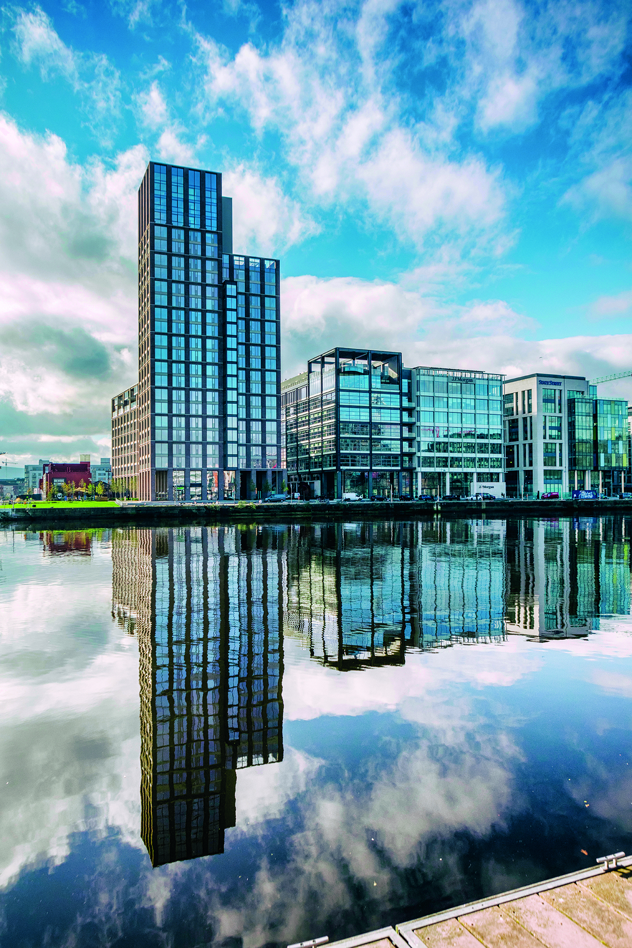 Image of tall buildings with reflection in the Liffey